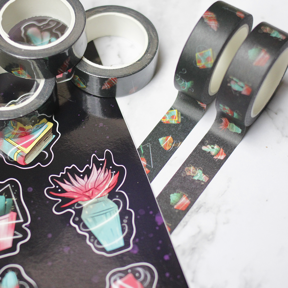 Japanese paper tape that is black with a pattern of cacti and one with a pattern of witch related items.